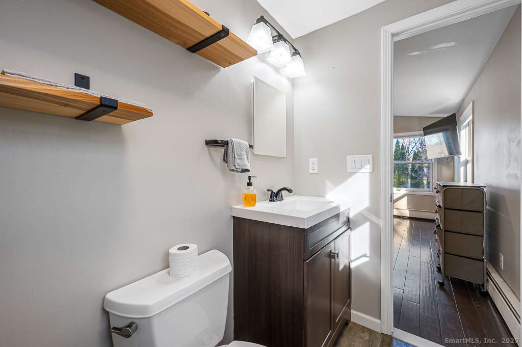 437 Somers Road Ellington, CT 06029 - Photo 19 of 40 a living room with furniture and a table