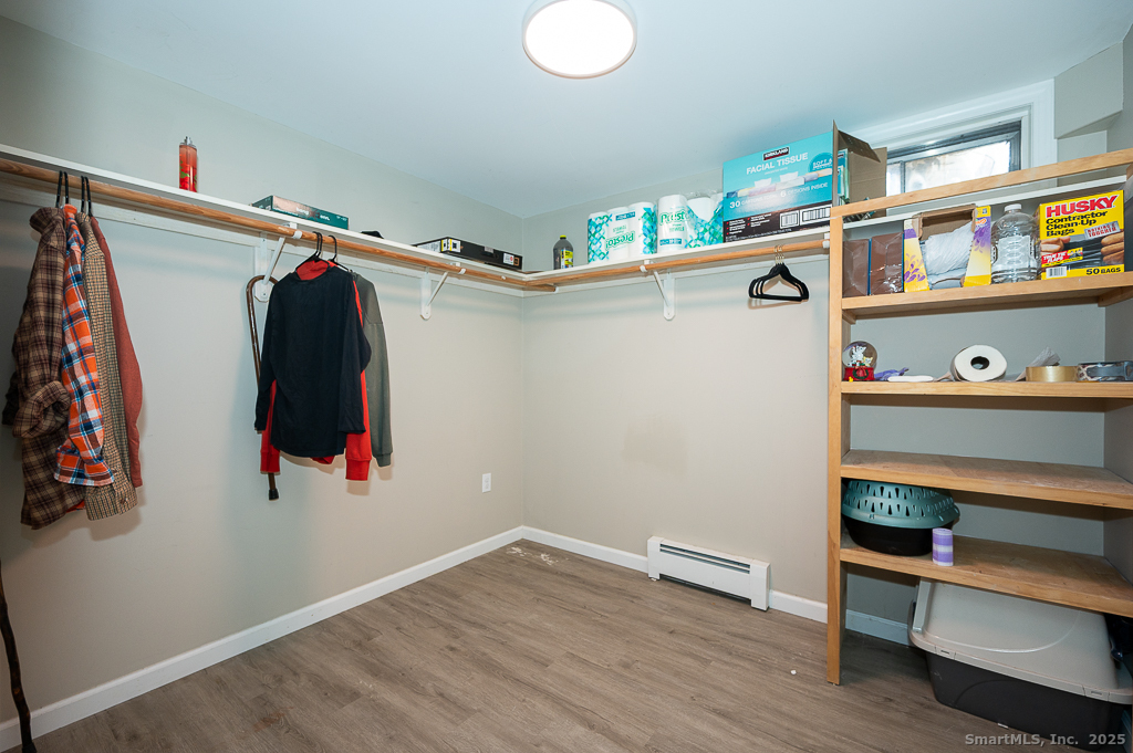 437 Somers Road Ellington, CT 06029 - Photo 28 of 40 a view of walk in closet with clothes and shoes