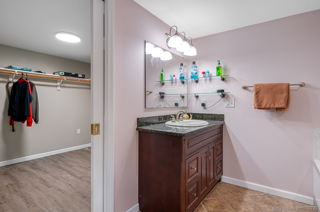 437 Somers Road Ellington, CT 06029 - Photo 30 of 40 a kitchen with kitchen island a sink stove and refrigerator