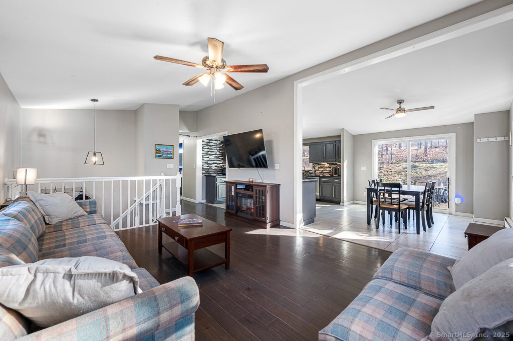 437 Somers Road Ellington, CT 06029 - Photo 4 of 40 a living room with furniture and a flat screen tv