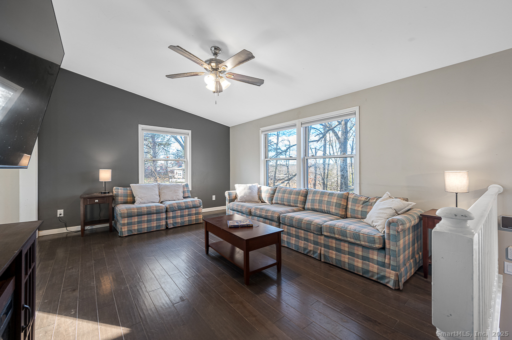 437 Somers Road Ellington, CT 06029 - Photo 6 of 40 a living room with furniture and a wooden floor