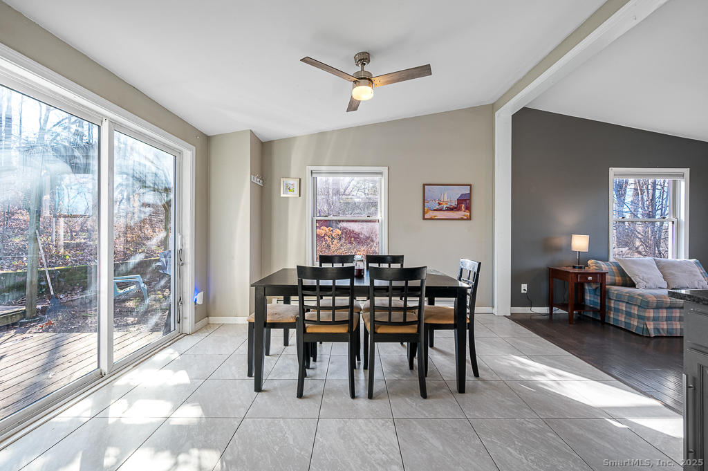 437 Somers Road Ellington, CT 06029 - Photo 8 of 40 a view of a dining room with furniture window and outside view