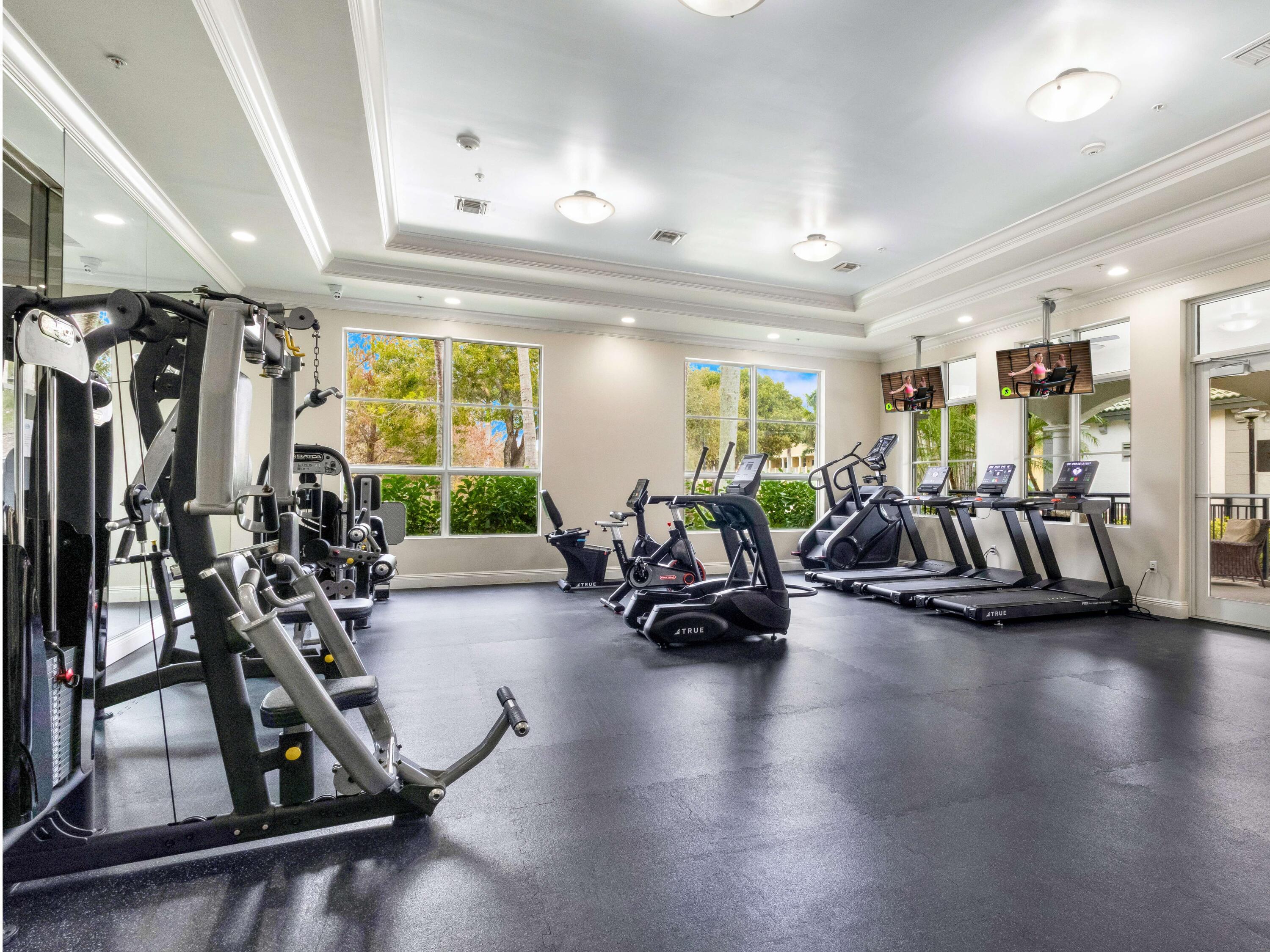 1690 Renaissance Commons Boulevard, Unit 1412 Boynton Beach, FL 33426 - Photo 38 of 49 a view of a room with gym equipment