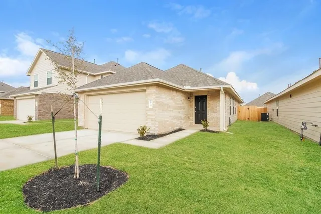 a view of a house with a backyard porch and sitting area