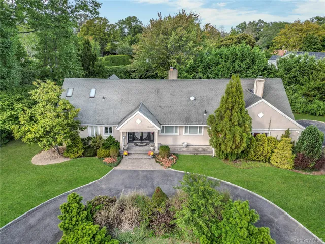 an aerial view of a house with yard