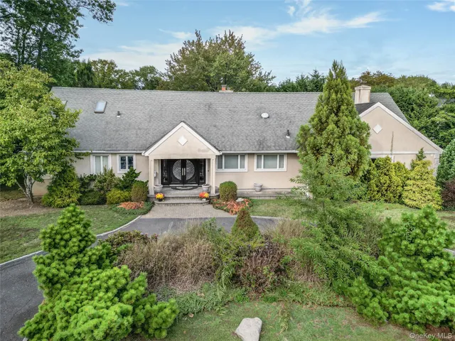 a aerial view of a house with table and chairs in patio