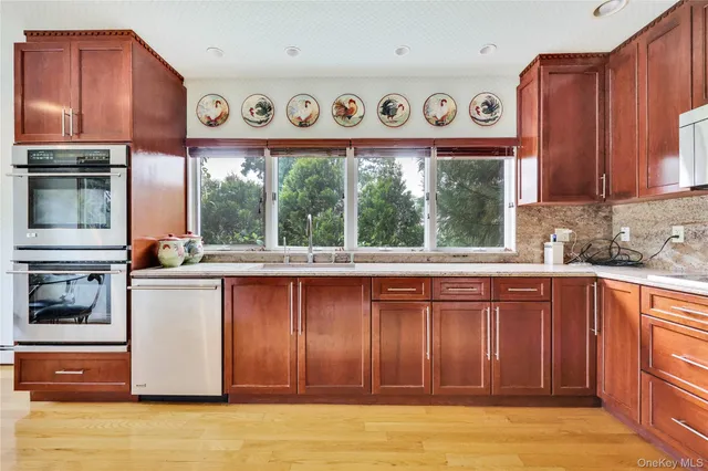 a view of workspace with wooden floor windows