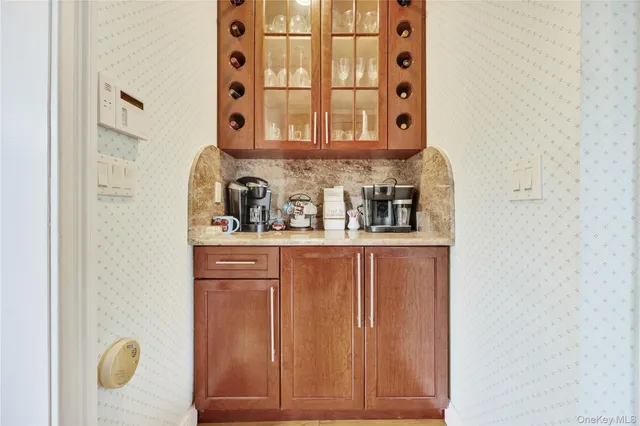 a bedroom with a bed and a refrigerator