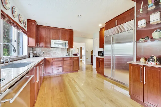 a bed sitting in a room next to a window