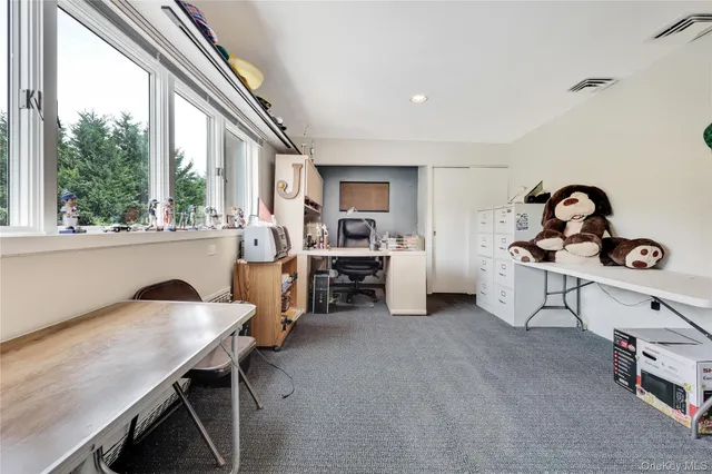 a bathroom with a sink a toilet and a window