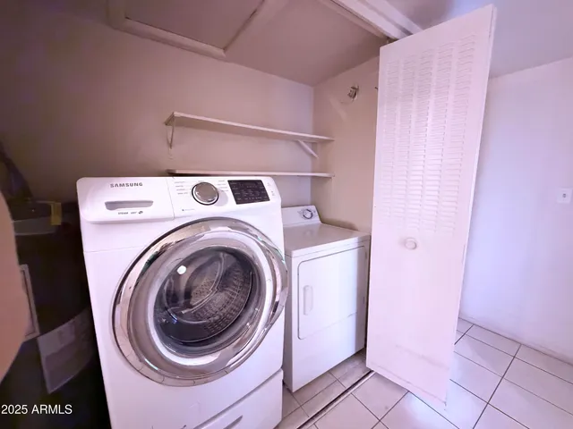 a bathroom with a sink a toilet a mirror and shower