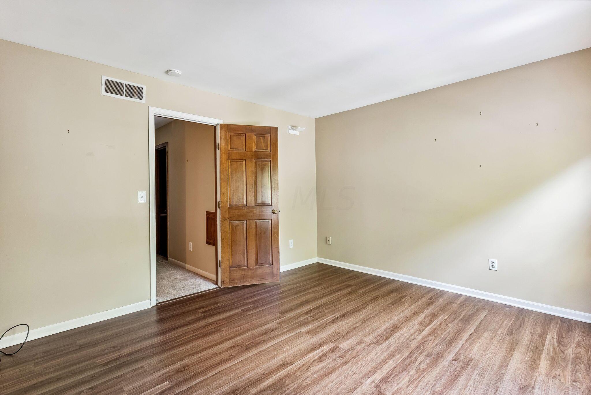2164 Sandston Road Columbus, OH 43220 - Photo 24 of 55 BEDROOM 2 ON MAIN LEVEL W/ NEWER FLOORING