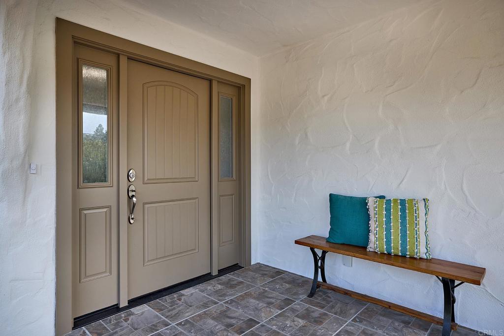 341 Cole Ranch Road Encinitas, CA 92024 - Photo 15 of 44 a view of a livingroom with furniture and a window