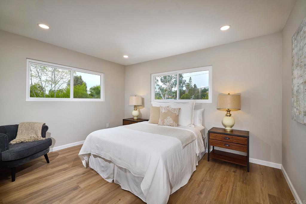 341 Cole Ranch Road Encinitas, CA 92024 - Photo 29 of 44 a bedroom with a bed and wooden floor