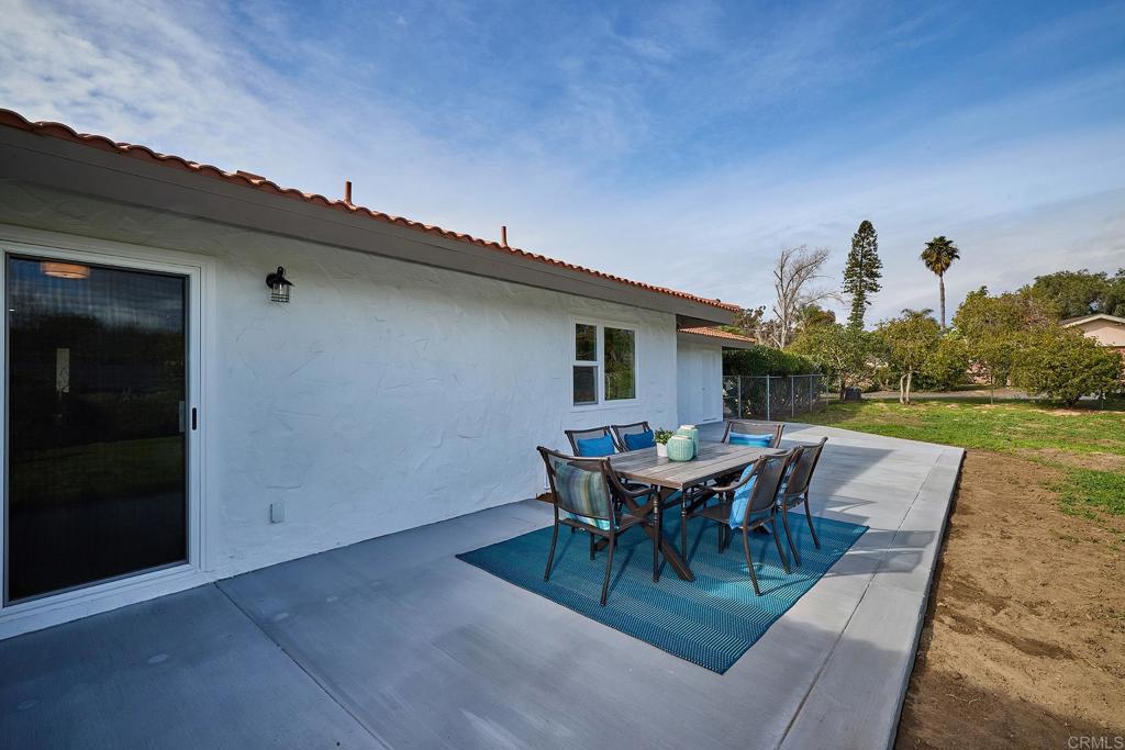 341 Cole Ranch Road Encinitas, CA 92024 - Photo 30 of 44 a view of a patio with table and chairs