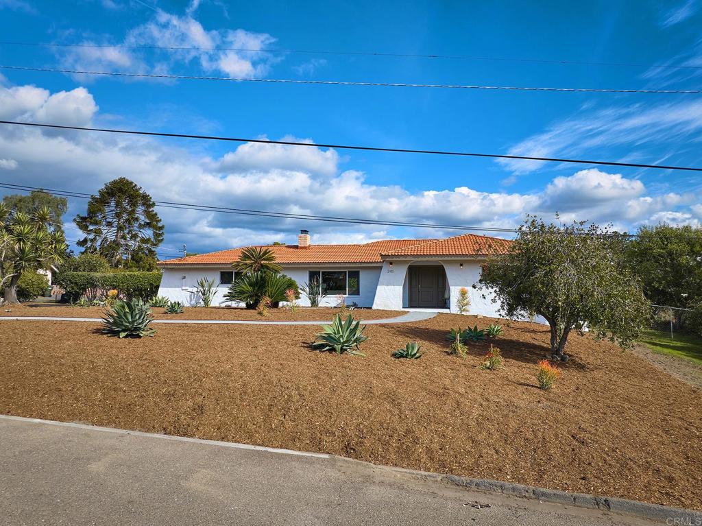 341 Cole Ranch Road Encinitas, CA 92024 - Photo 41 of 44 a front view of a house with a yard
