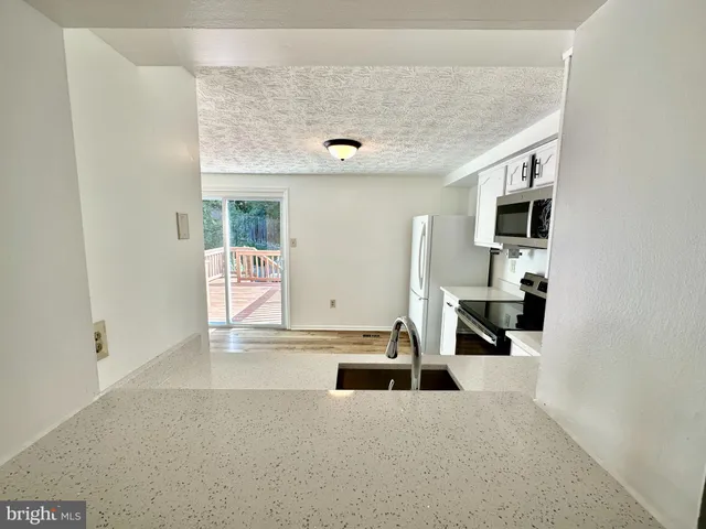 a view of a livingroom with a flat screen tv