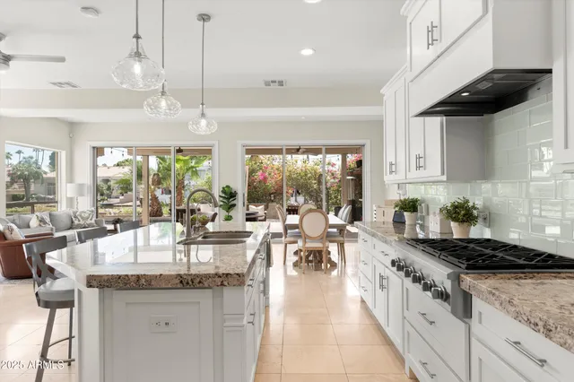a spacious bedroom with a large bed and a large window