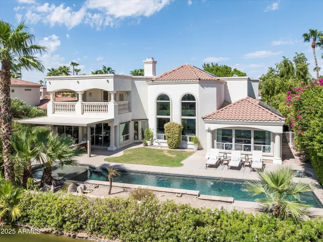 a front view of a house with garden and porch
