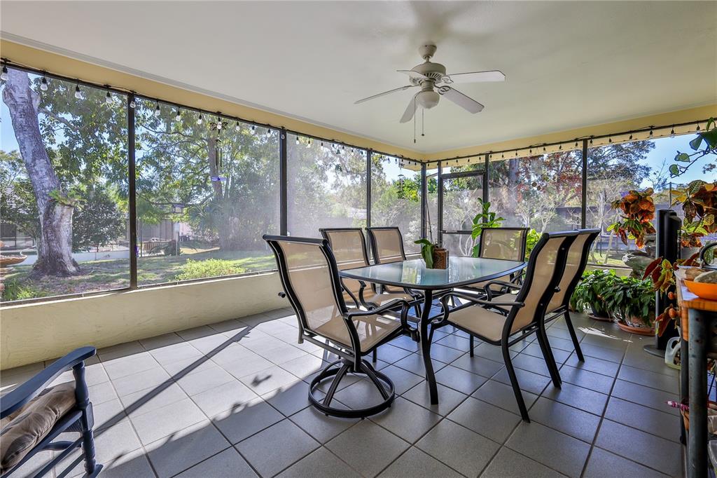 11249 Riddle Drive Spring Hill, FL 34609 - Photo 33 of 43 a view of a dining room with furniture window and outside view