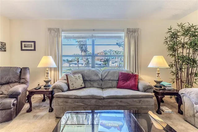 a dining room with furniture entryway and wooden floor