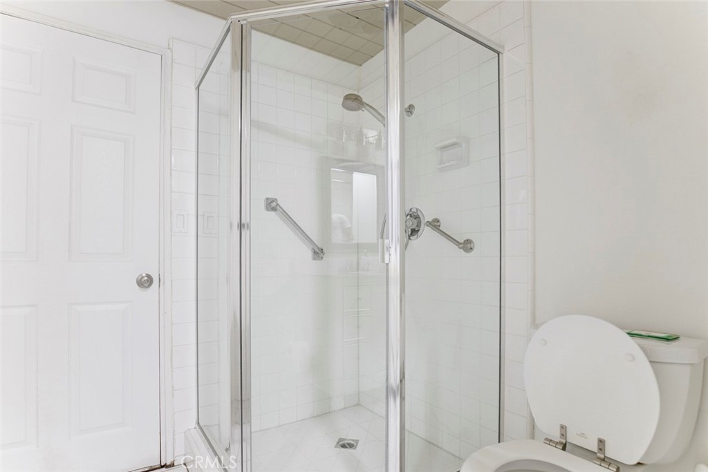 10412 Reseda Boulevard Porter Ranch, CA 91326 - Photo 14 of 38 a bathroom with a shower and a toilet