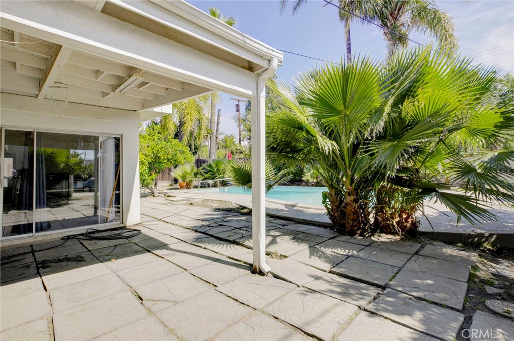 10412 Reseda Boulevard Porter Ranch, CA 91326 - Photo 18 of 38 a view of a room with a floor to ceiling window and potted plants