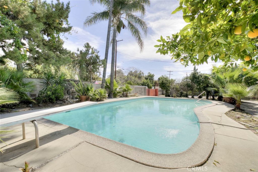 10412 Reseda Boulevard Porter Ranch, CA 91326 - Photo 20 of 38 a view of a swimming pool with a yard