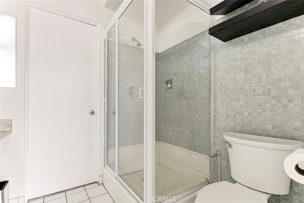 10412 Reseda Boulevard Porter Ranch, CA 91326 - Photo 4 of 38 a bathroom with a toilet and a shower