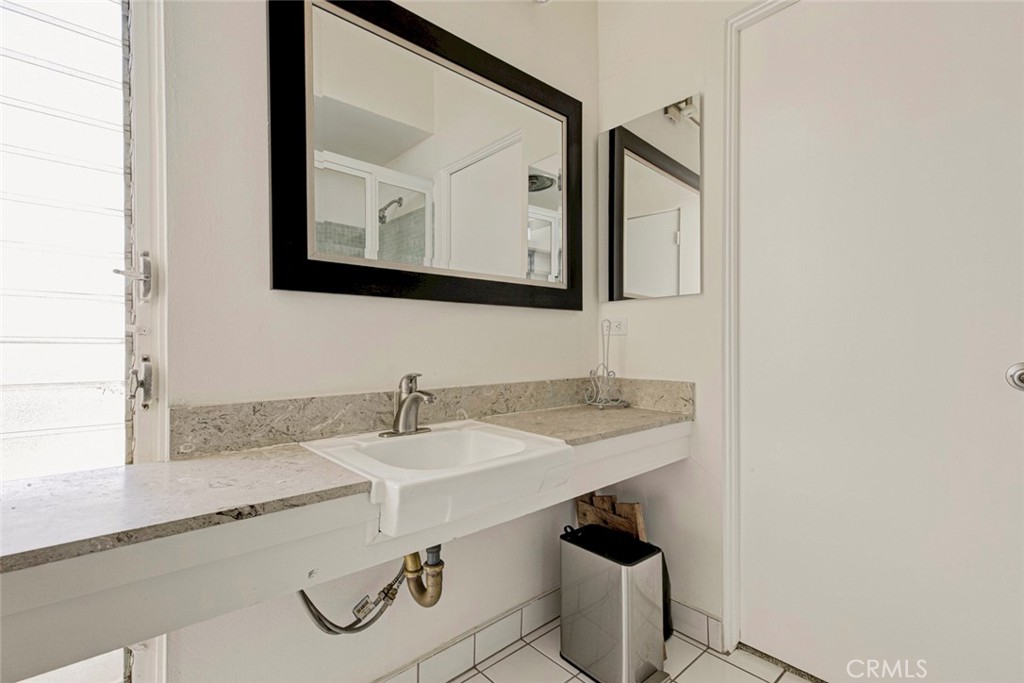 10412 Reseda Boulevard Porter Ranch, CA 91326 - Photo 5 of 38 a bathroom with a sink and a mirror