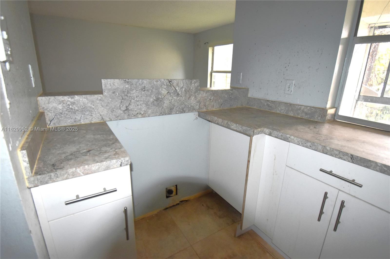 4231 Northwest 19th Street, Unit 256 Lauderhill, FL 33313 - Photo 15 of 16 a view of a kitchen that shows a sink and dishwasher in a kitchen