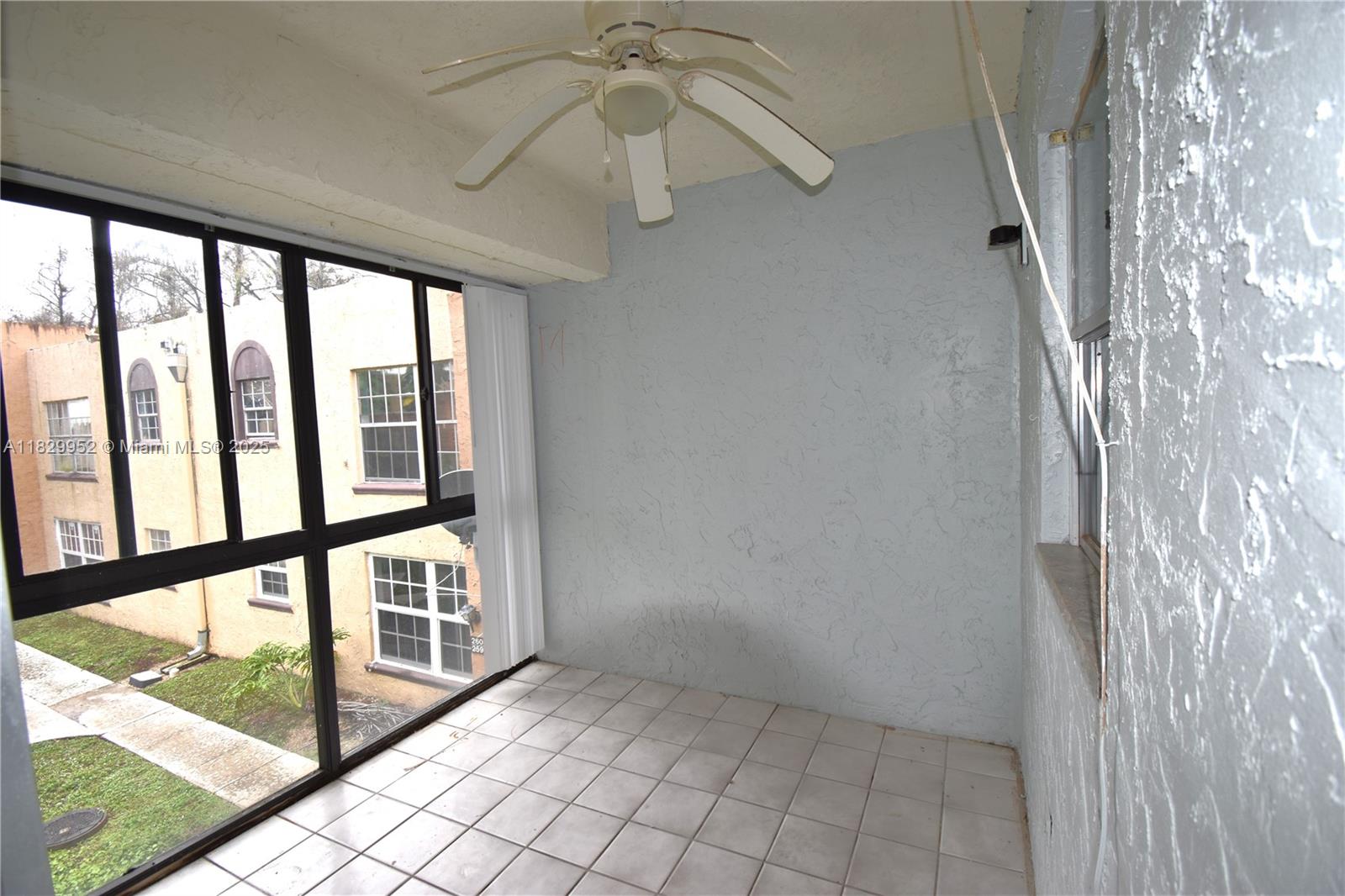 4231 Northwest 19th Street, Unit 256 Lauderhill, FL 33313 - Photo 16 of 16 a view of a hallway with wooden floor and windows
