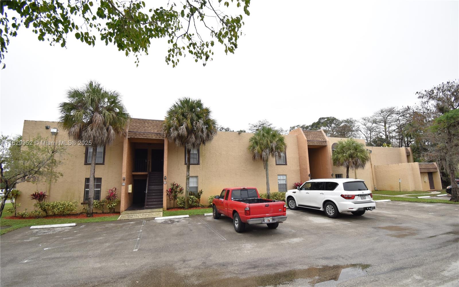 4231 Northwest 19th Street, Unit 256 Lauderhill, FL 33313 - Photo 2 of 16 a car parked in front of a house