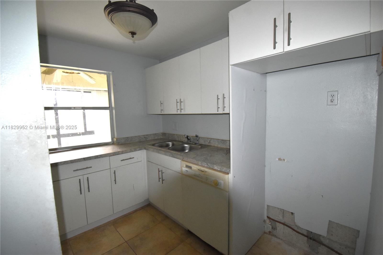 4231 Northwest 19th Street, Unit 256 Lauderhill, FL 33313 - Photo 4 of 16 a kitchen with sink cabinets and appliances