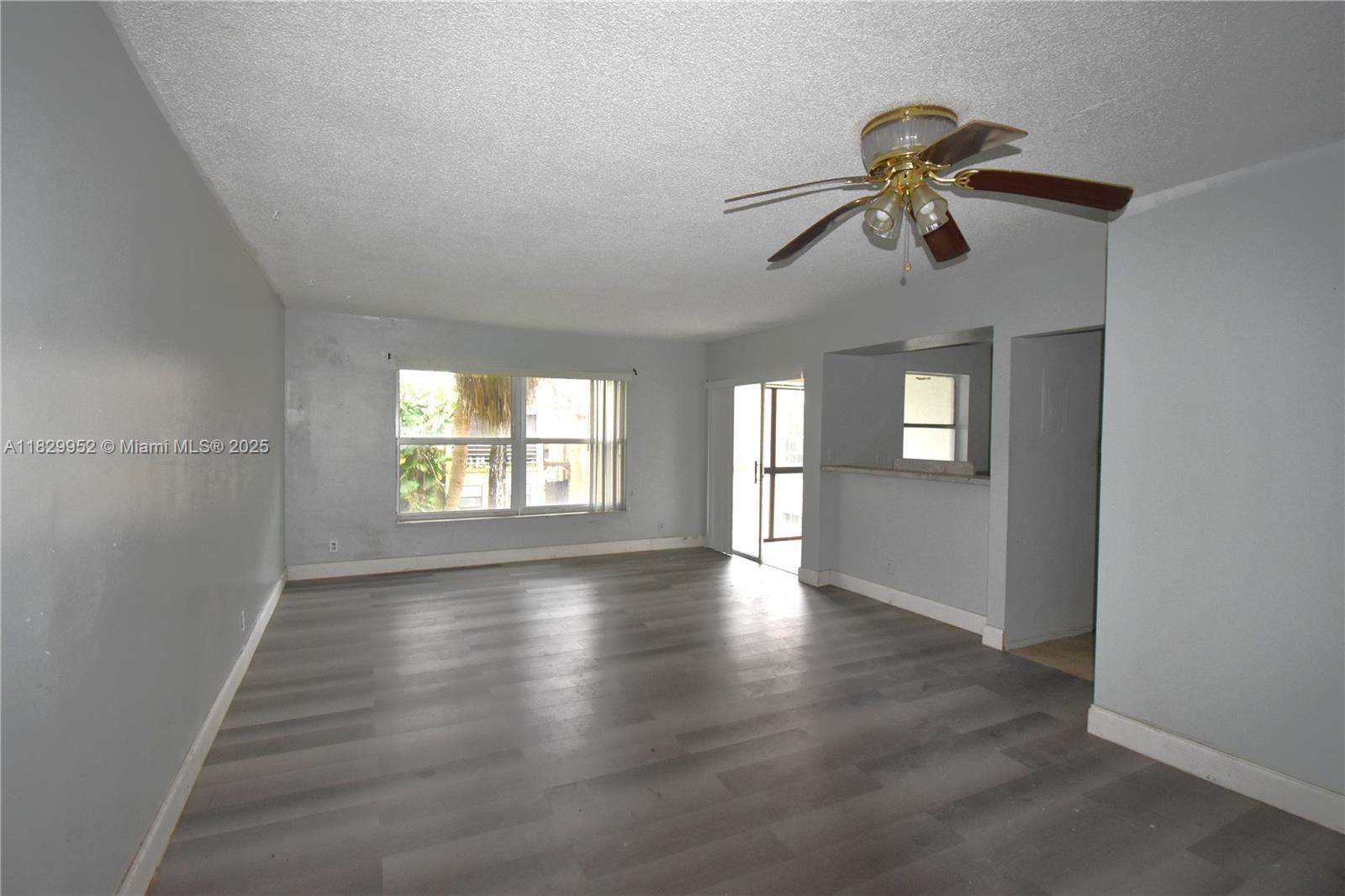 4231 Northwest 19th Street, Unit 256 Lauderhill, FL 33313 - Photo 6 of 16 a view of an empty room with a window
