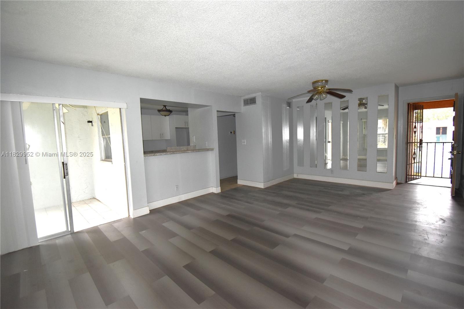 4231 Northwest 19th Street, Unit 256 Lauderhill, FL 33313 - Photo 7 of 16 a view of a big room with wooden floor and windows