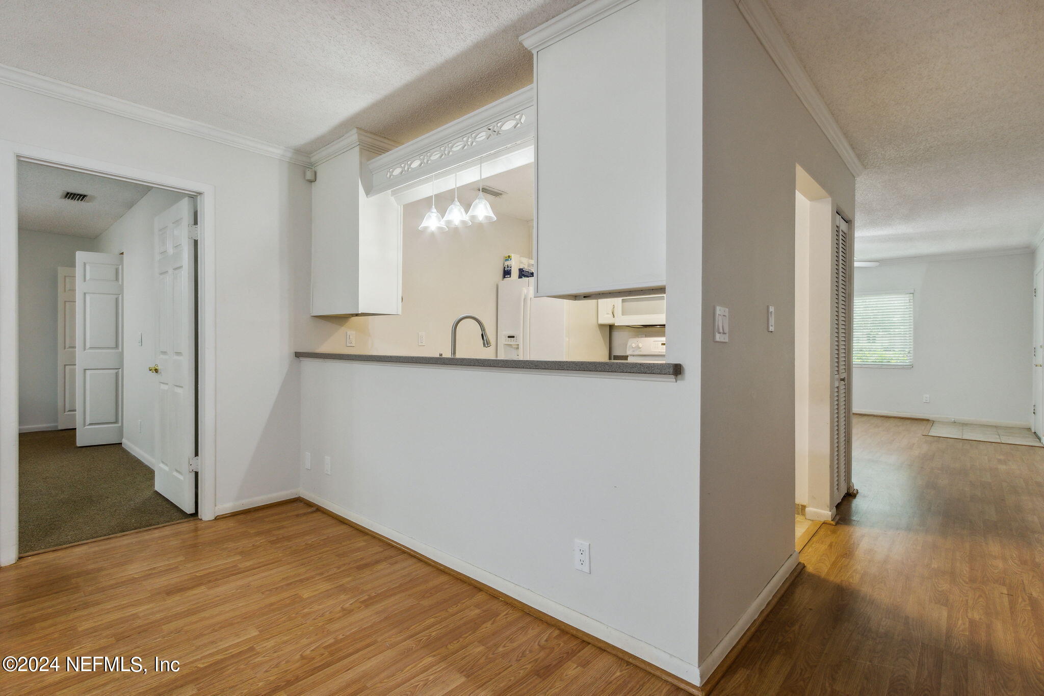 1213 The Grove Road Orange Park, FL 32073 - Photo 12 of 40 a view of a kitchen from the hallway