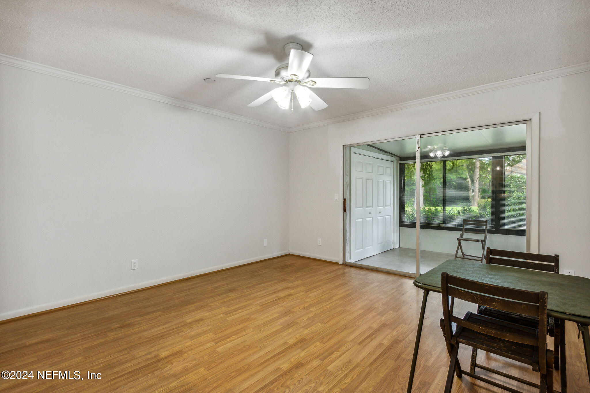 1213 The Grove Road Orange Park, FL 32073 - Photo 16 of 40 wooden floor in an empty room with a window