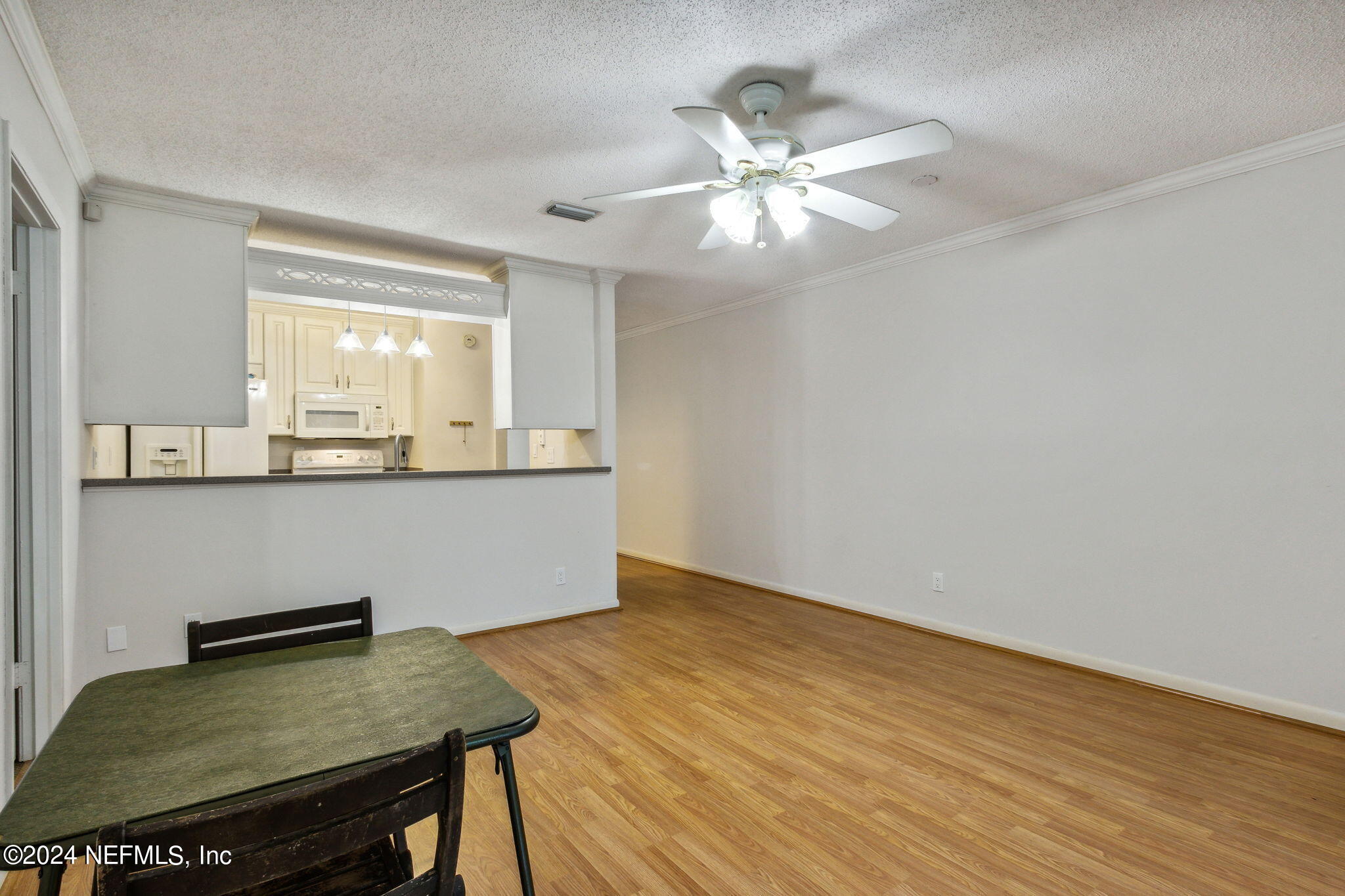 1213 The Grove Road Orange Park, FL 32073 - Photo 17 of 40 a view of a room with a table and chandelier