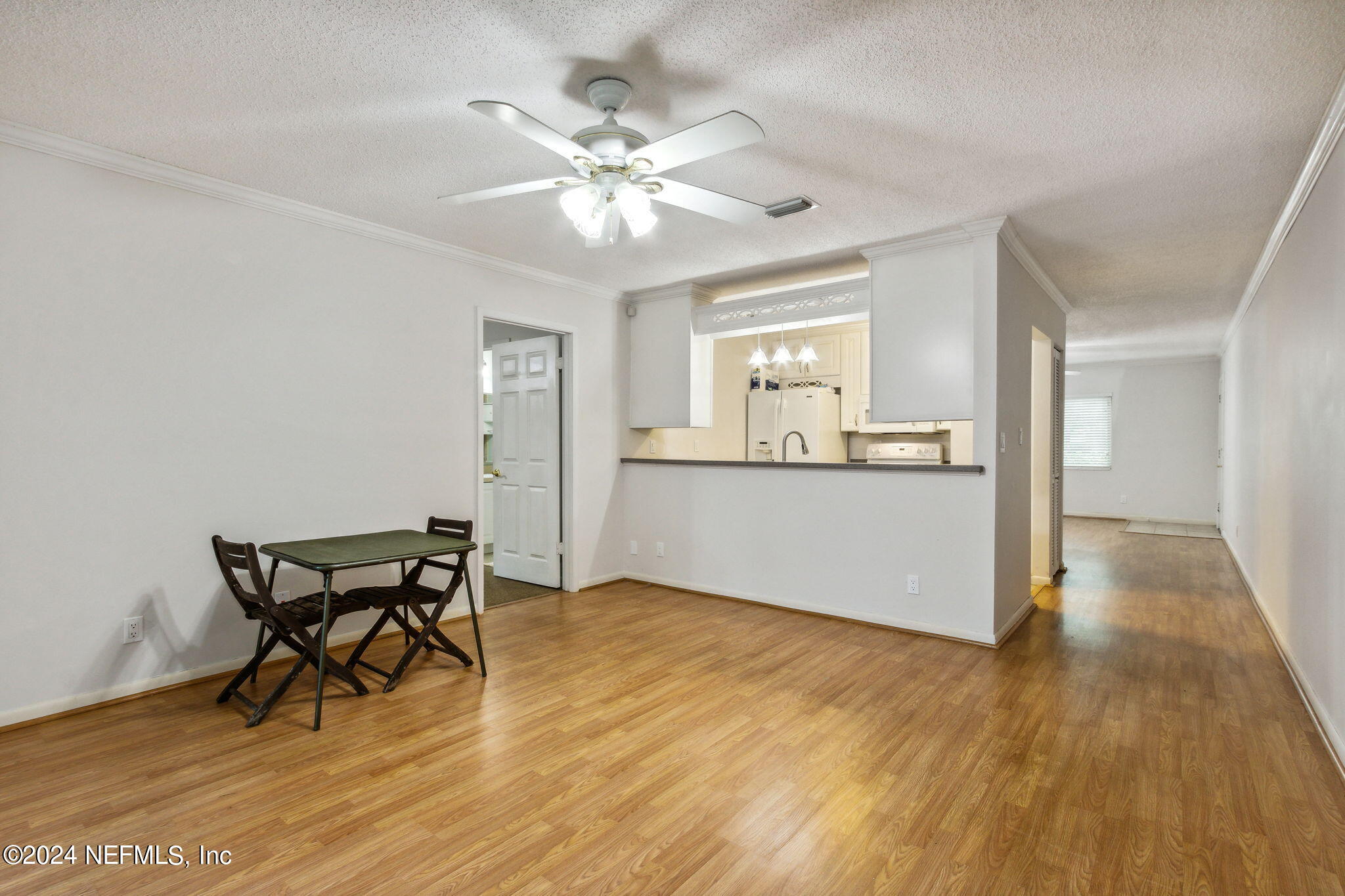 1213 The Grove Road Orange Park, FL 32073 - Photo 18 of 40 a view of a dining room with furniture and wooden floor