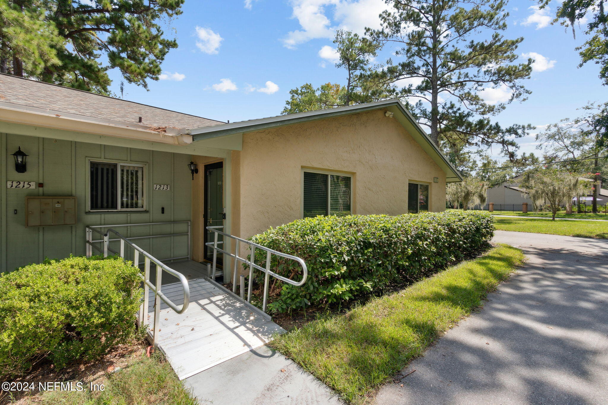 1213 The Grove Road Orange Park, FL 32073 - Photo 2 of 40 a front view of a house with a yard