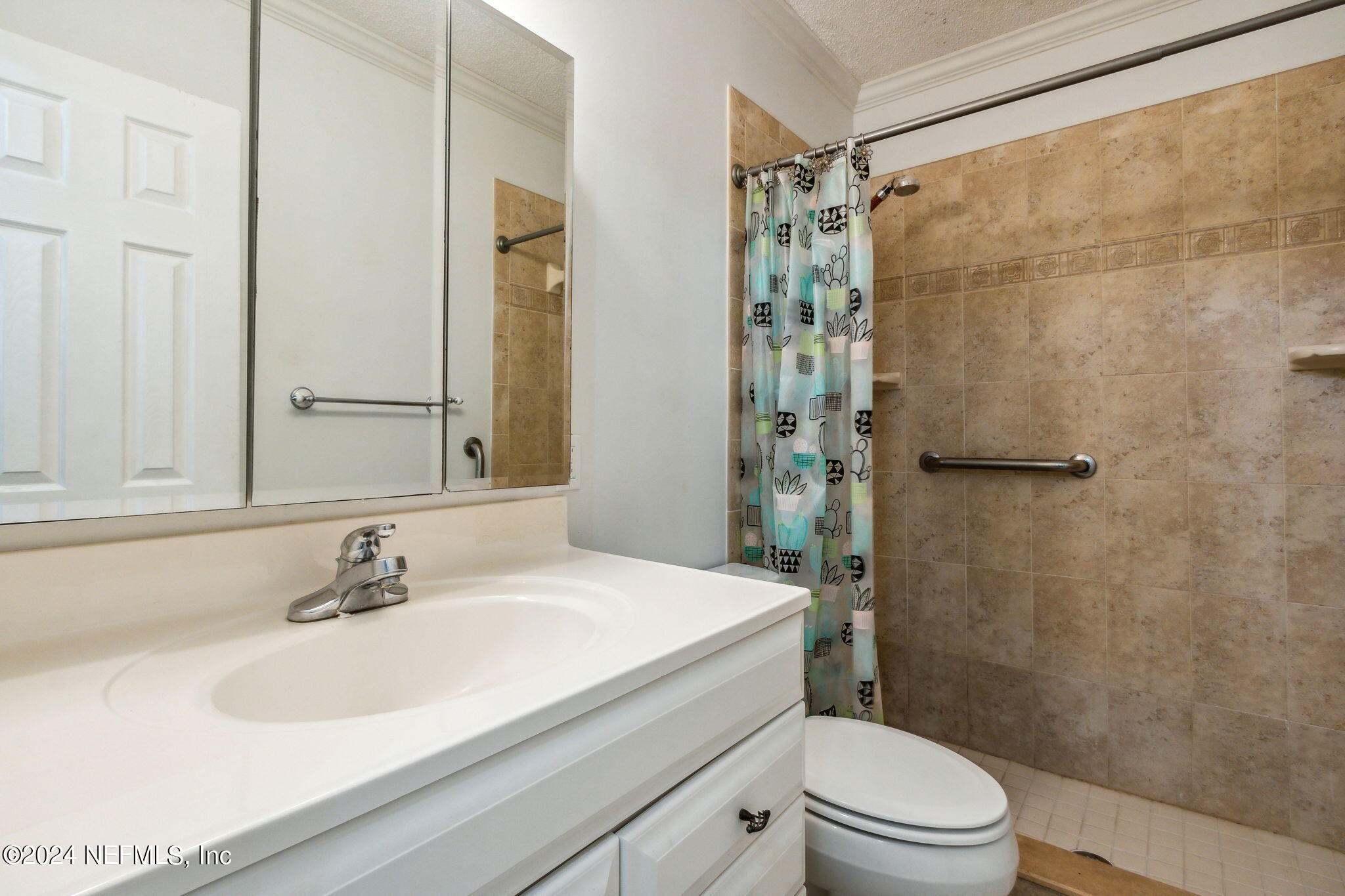 1213 The Grove Road Orange Park, FL 32073 - Photo 22 of 40 a bathroom with a sink a toilet and shower