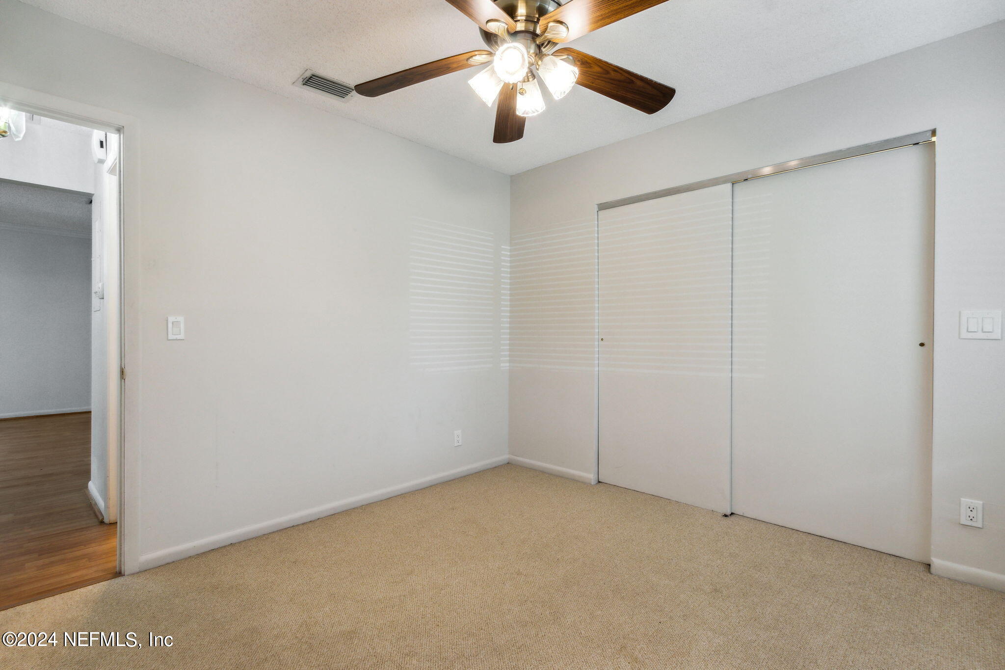 1213 The Grove Road Orange Park, FL 32073 - Photo 23 of 40 a view of an empty room and chandelier fan