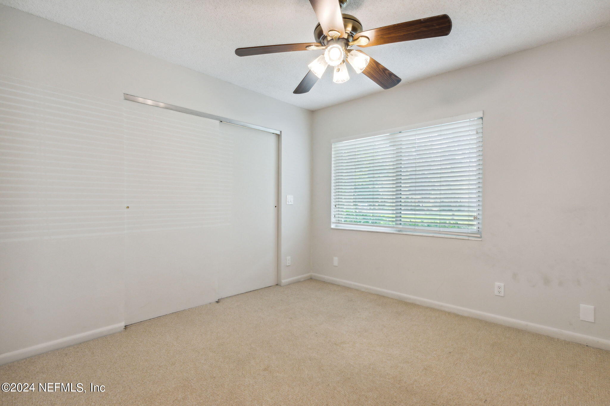 1213 The Grove Road Orange Park, FL 32073 - Photo 24 of 40 an empty room with windows and fan