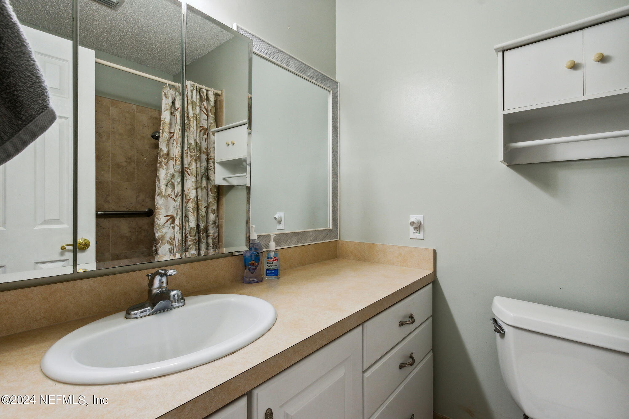 1213 The Grove Road Orange Park, FL 32073 - Photo 25 of 40 a bathroom with a sink toilet and shower