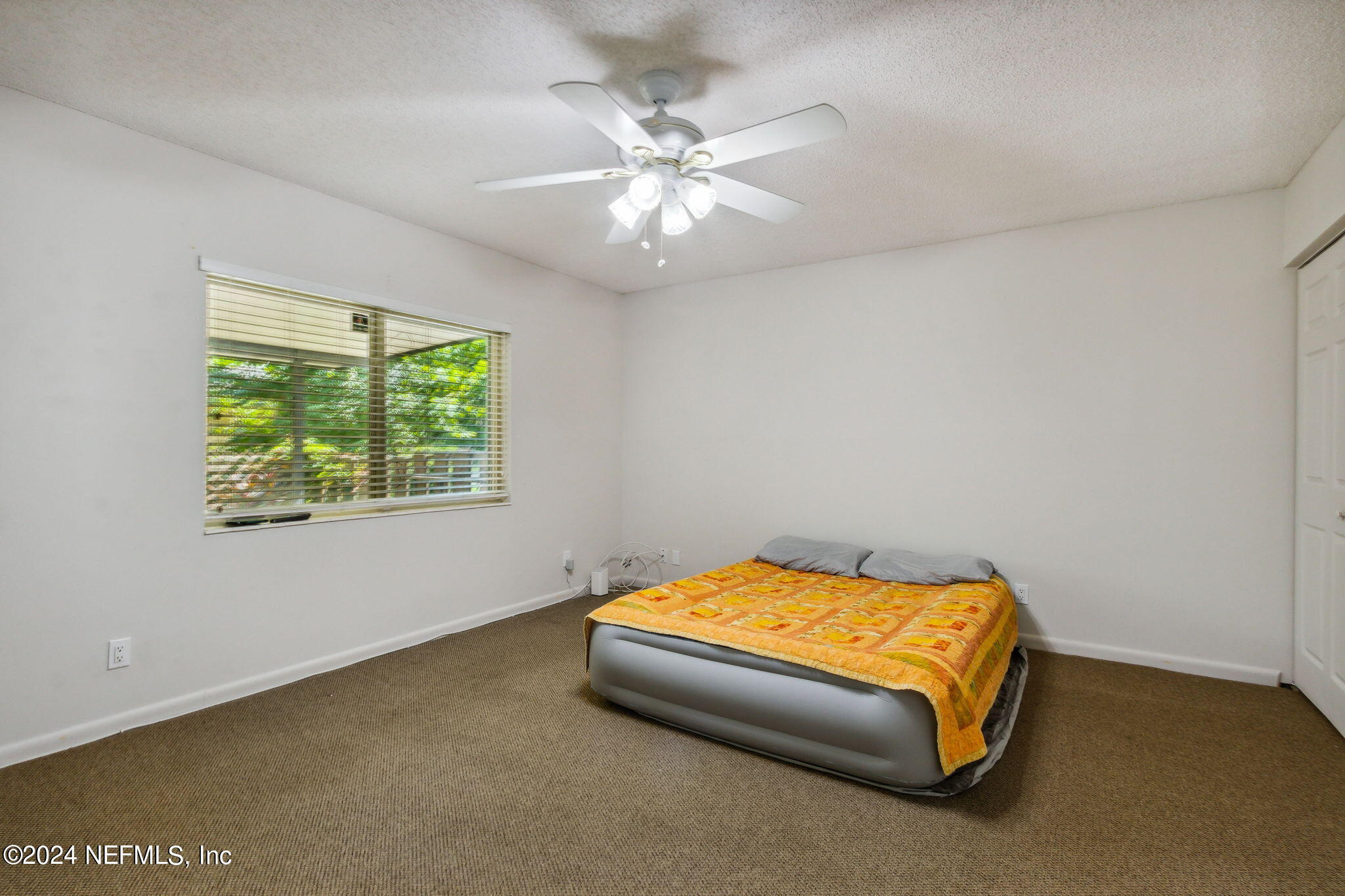 1213 The Grove Road Orange Park, FL 32073 - Photo 26 of 40 a bedroom with a bed and a ceiling fan
