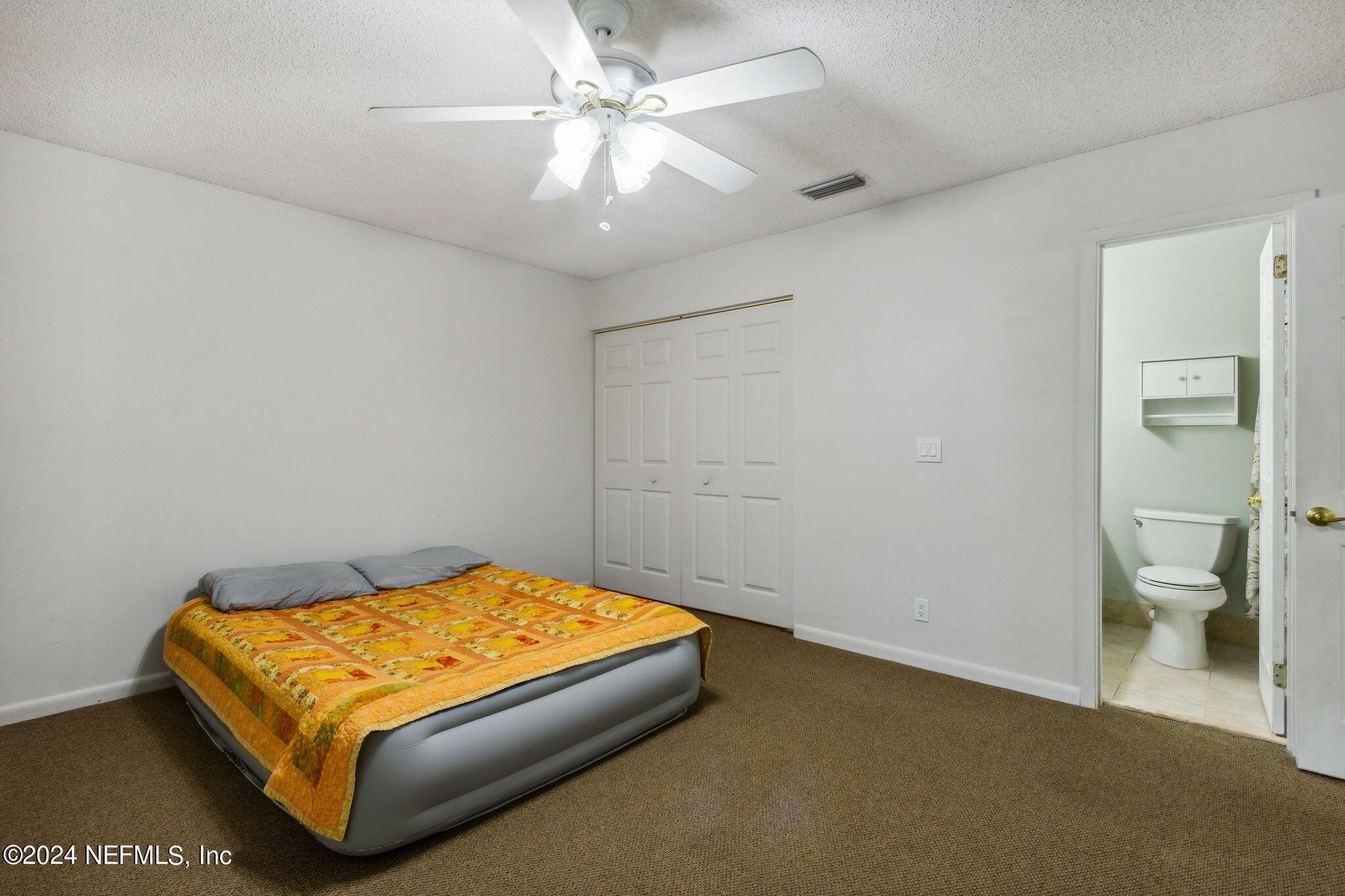 1213 The Grove Road Orange Park, FL 32073 - Photo 27 of 40 a bedroom with a bed and bathroom
