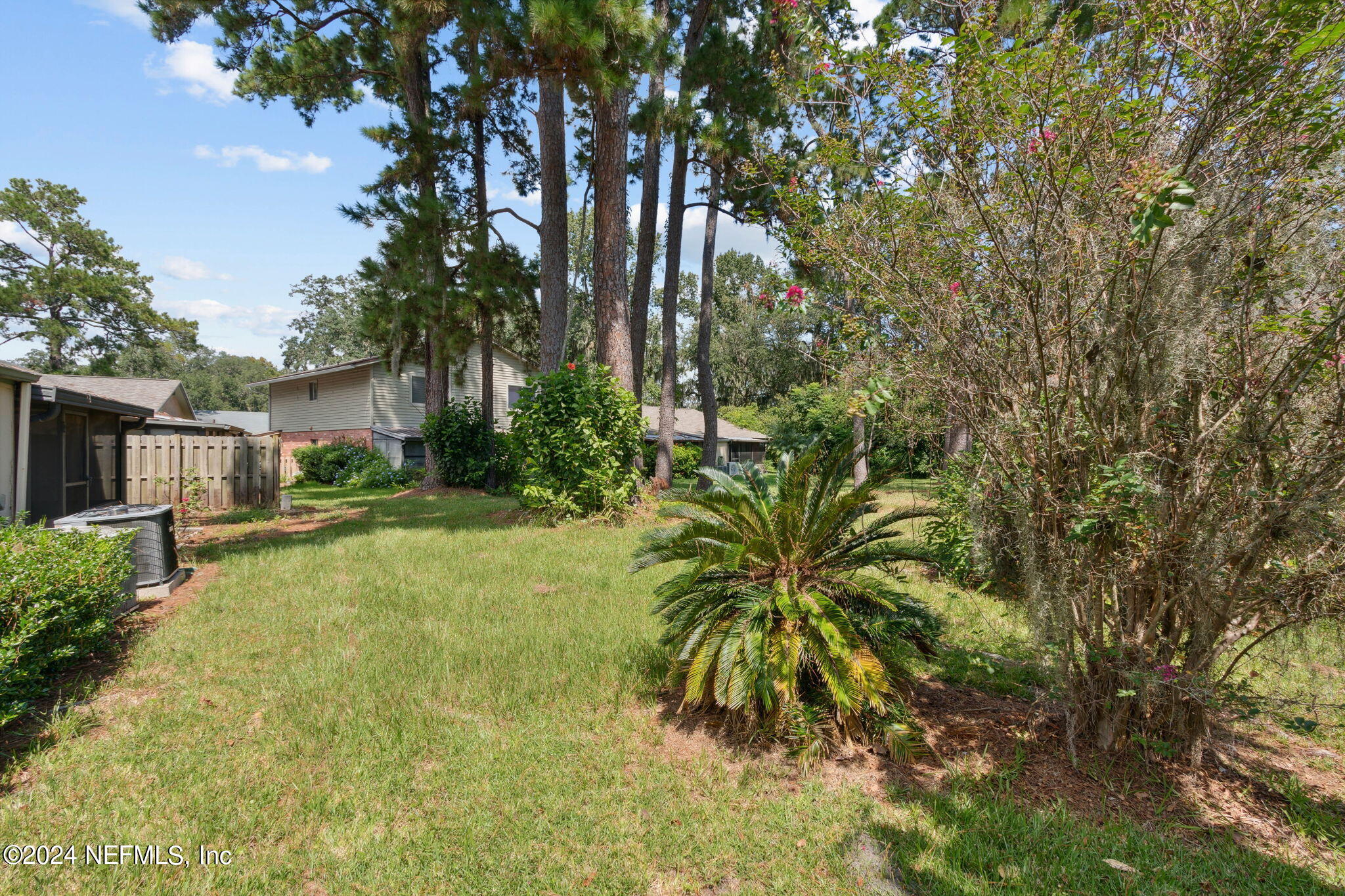 1213 The Grove Road Orange Park, FL 32073 - Photo 32 of 40 a backyard of a house with table and chairs