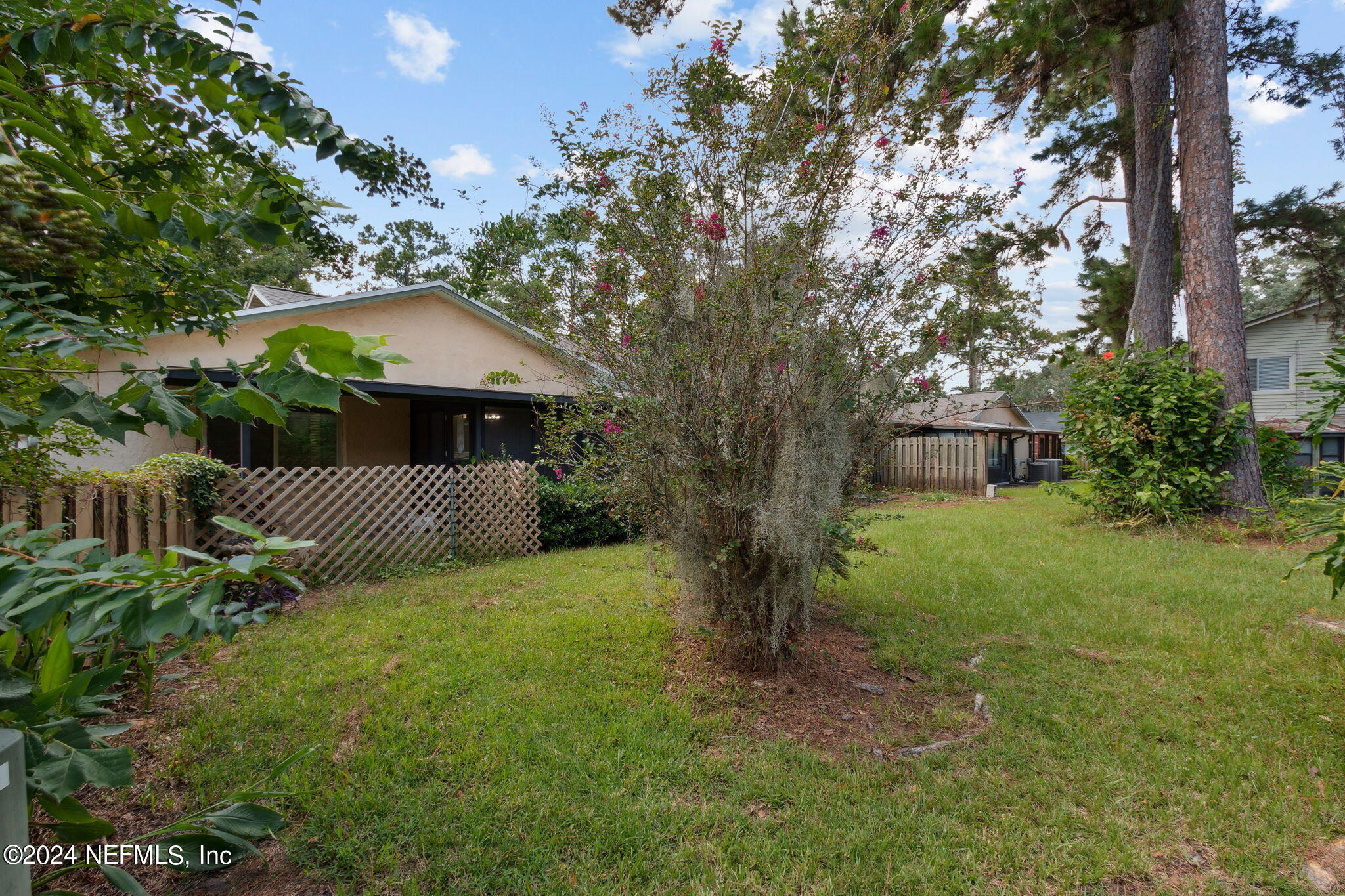 1213 The Grove Road Orange Park, FL 32073 - Photo 34 of 40 a front view of a house with garden