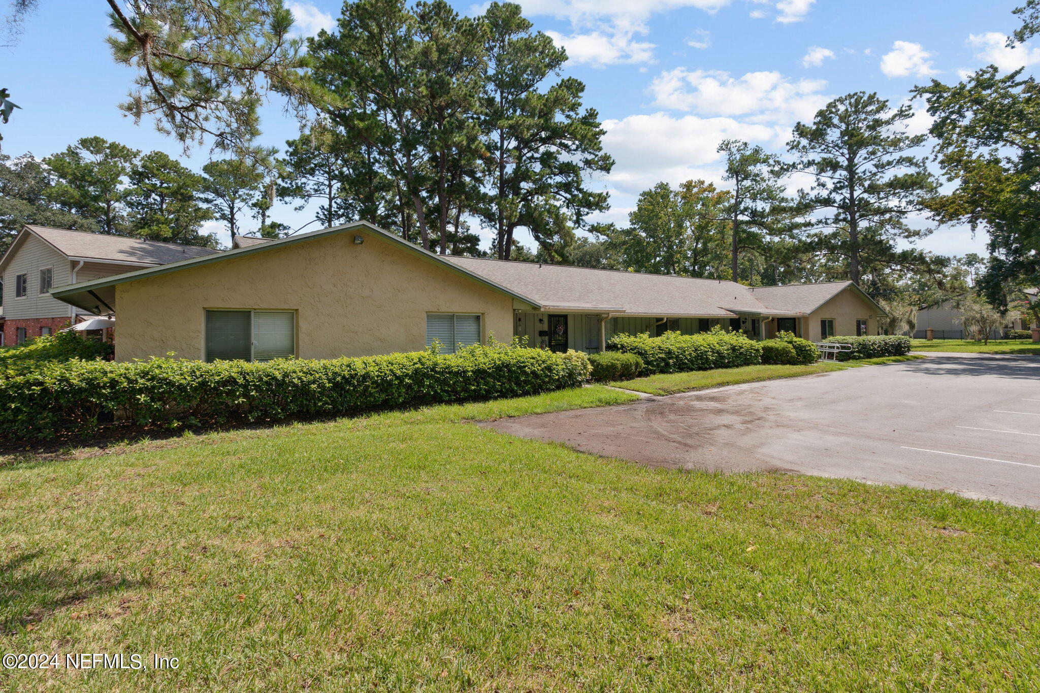 1213 The Grove Road Orange Park, FL 32073 - Photo 35 of 40 a yellow house with trees in the background